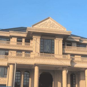 武威黄金麻别墅外墙干挂石材效果示例