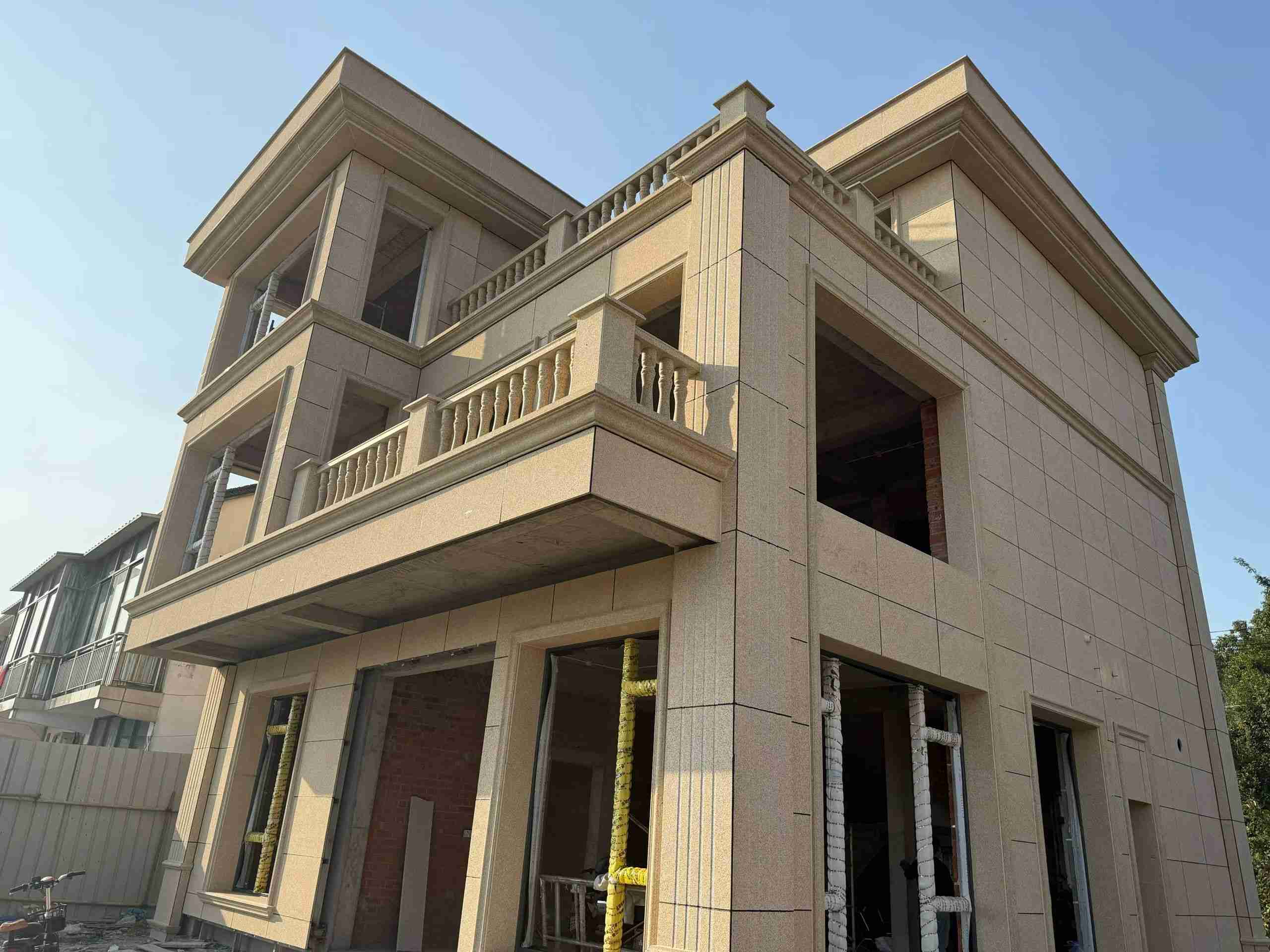 武威 黄金麻花岗岩石材荔枝面外墙干挂效果展示